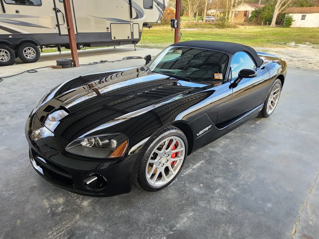 Black Dodge Viper SRT-10 roadster with a deep gloss