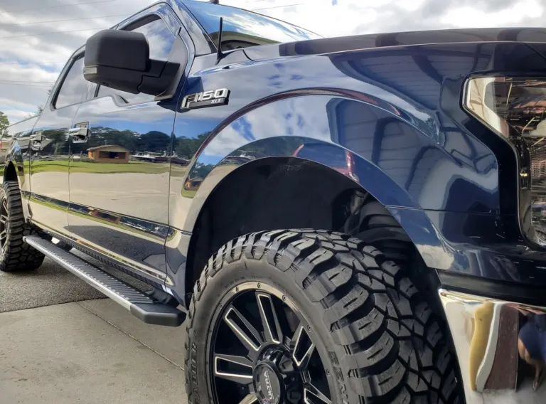 Black Ford F-150 XLT with glossy paint