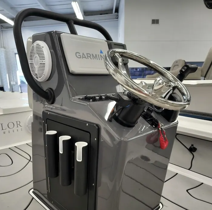 Boat helm console with stainless wheel