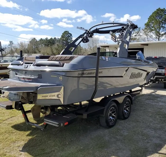 Boat on a trailer outside the shop