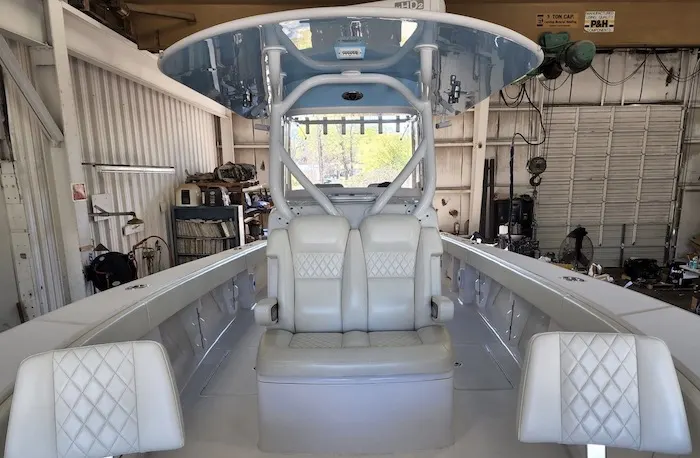 Center console boat helm seats under the T-top
