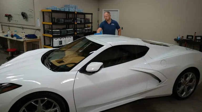 Inside the Elite shop in Statesboro GA with a white Corvette