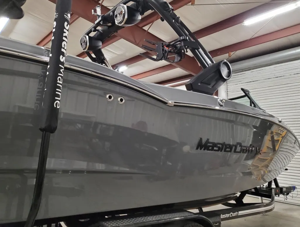 Gray MasterCraft wake boat in the shop