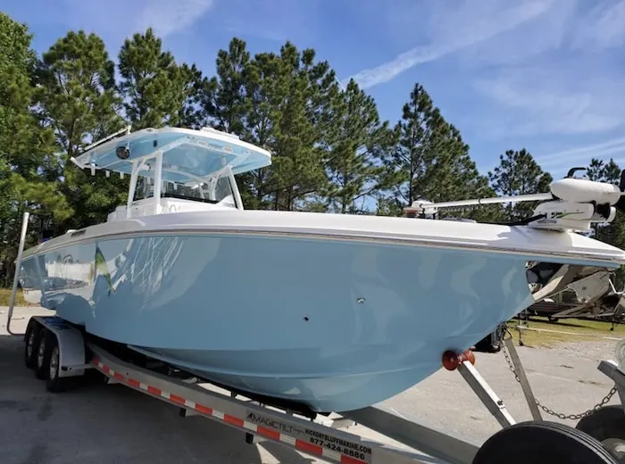 Light blue center console hull on a trailer