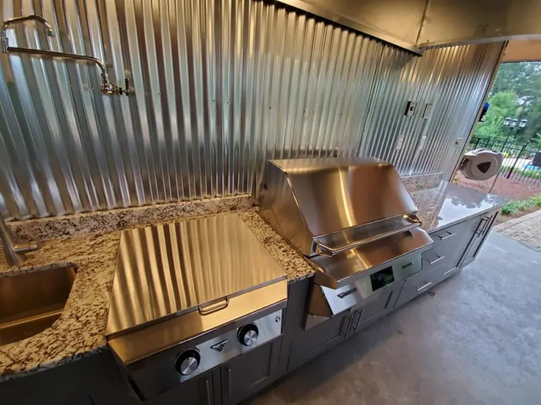 Outdoor kitchen grill and stone counter from the side