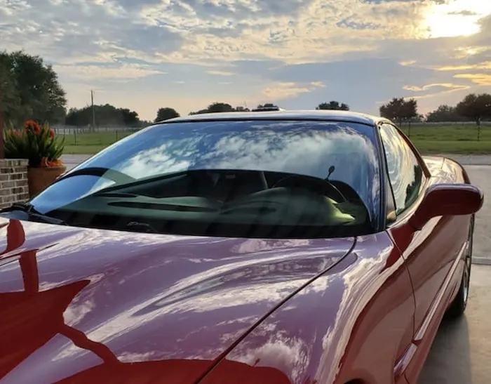 Red sports car at sunset