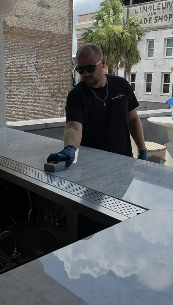 Clear film going on a rooftop bar counter in downtown Savannah GA