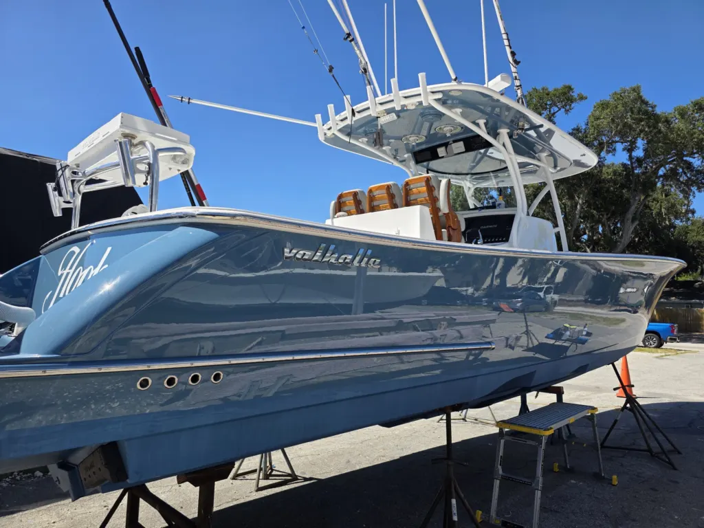 The Valhalla, a blue center console with Yacht Armor film, full side view on stands, Savannah GA