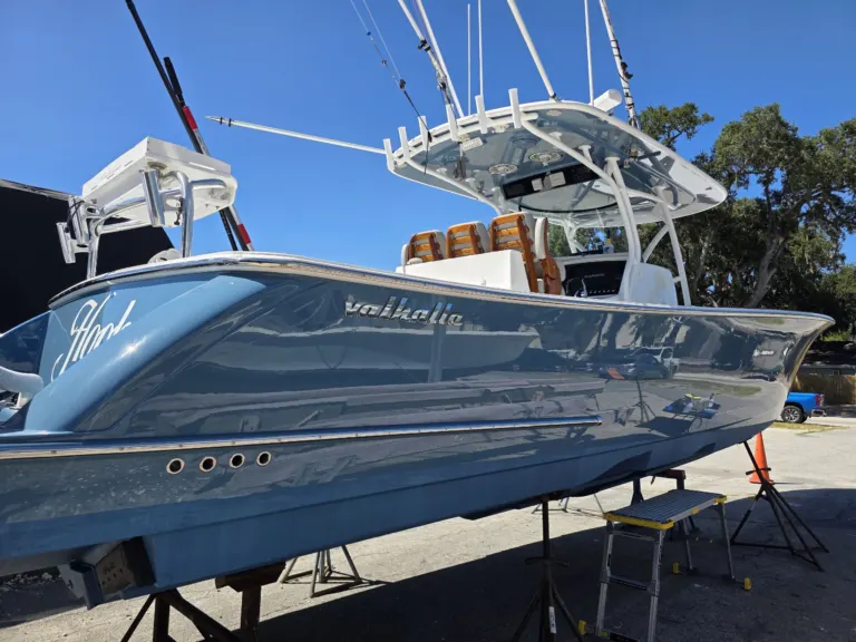 The Valhalla, a blue center console with Yacht Armor film, full side view on stands, Savannah GA